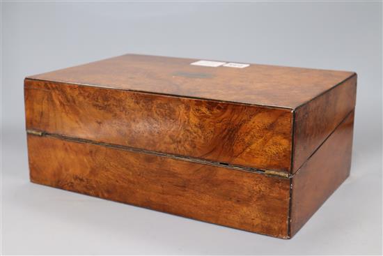 A burr walnut writing slope, with leather slope, inlaid plaque for C. Roberts